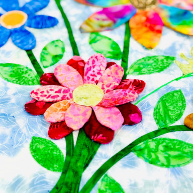 Colorful flower and leaf patterns on a textured white background