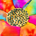 Colorful fabric flower with a circular wooden bead in the center