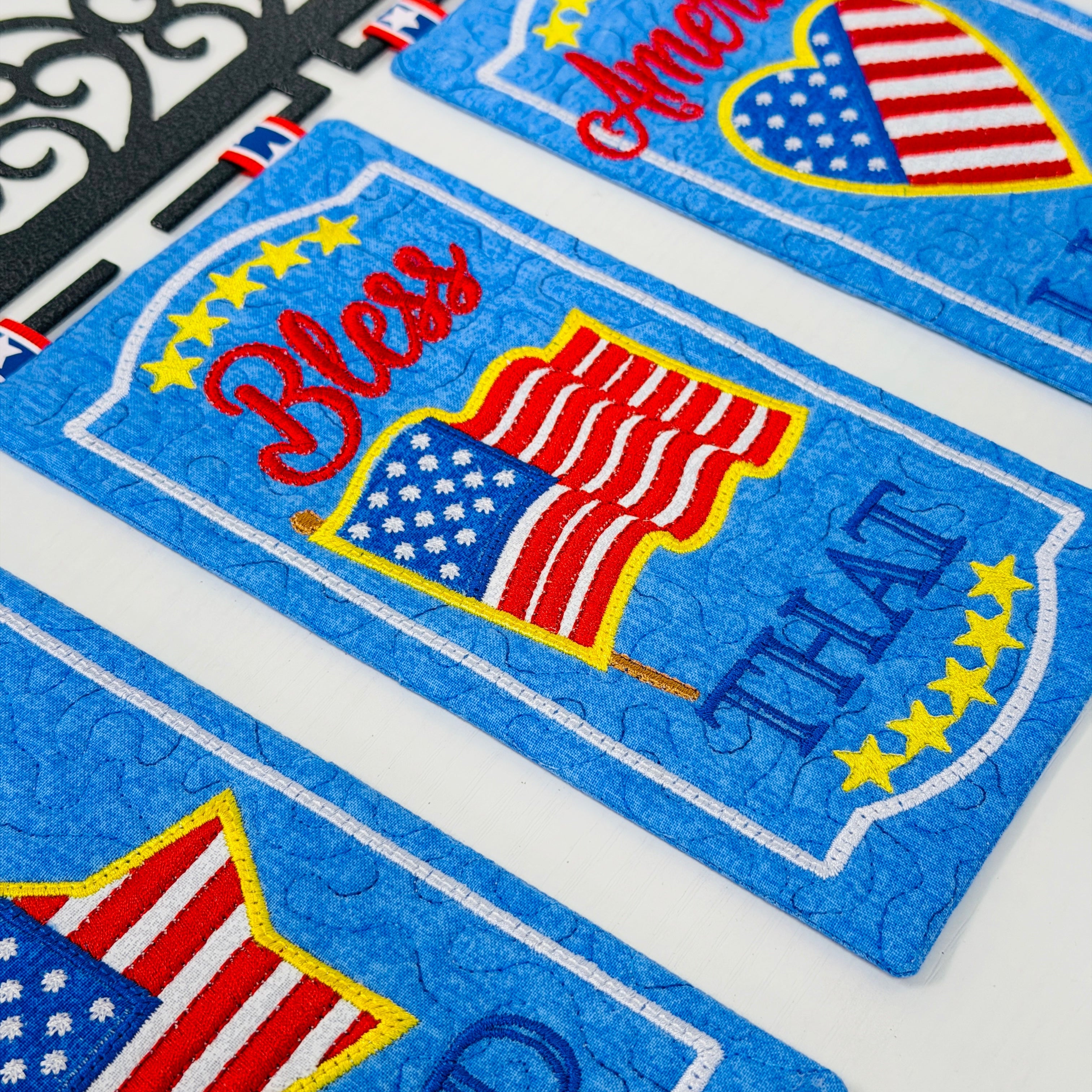Two patriotic coasters with American flag design and text on a white background