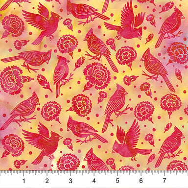 Fabric with red cardinal birds and pink flowers on a yellow background, ruler at the bottom for scale.