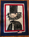 Quilt with a black and white illustration of a character wearing a top hat and bow tie, framed by a red, white, and blue border.