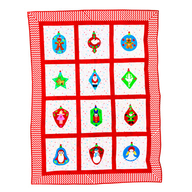 A square quilt or blanket with a red and white chevron border and a 3x4 grid of white panels, each featuring a colorful Christmas ornament illustration in red, green, blue, and gold.
