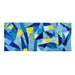 A rectangular patchwork quilt featuring an abstract geometric pattern of blue, navy, light blue, green, and yellow triangles, displayed flat against a solid white background.