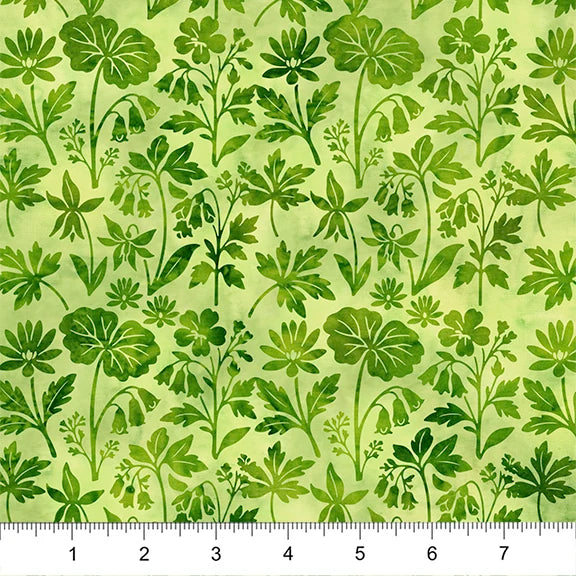Green floral patterned fabric with a ruler at the bottom