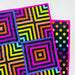 Colorful quilt with geometric patterns on a white background