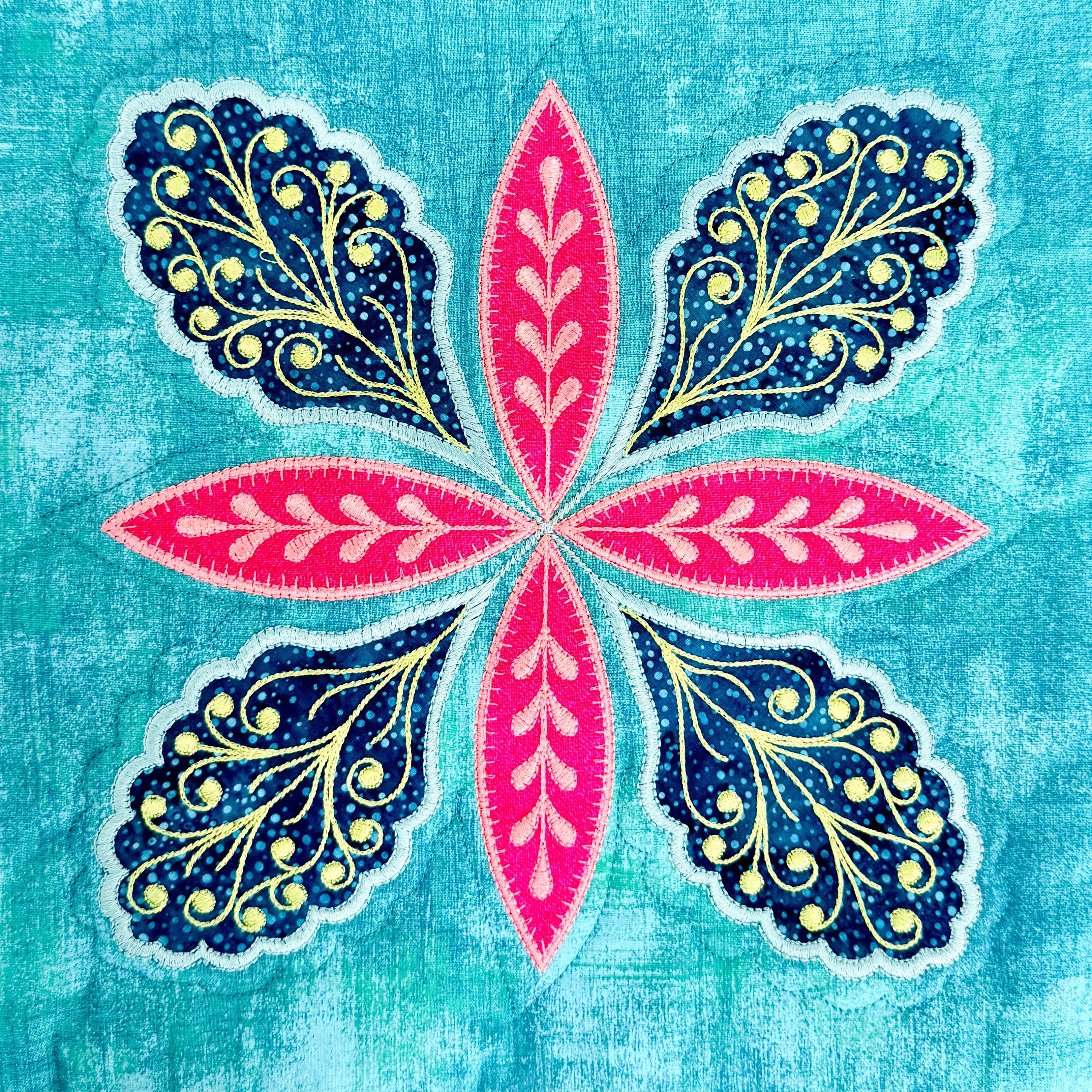 Decorative design with pink and blue floral patterns on a textured blue background
