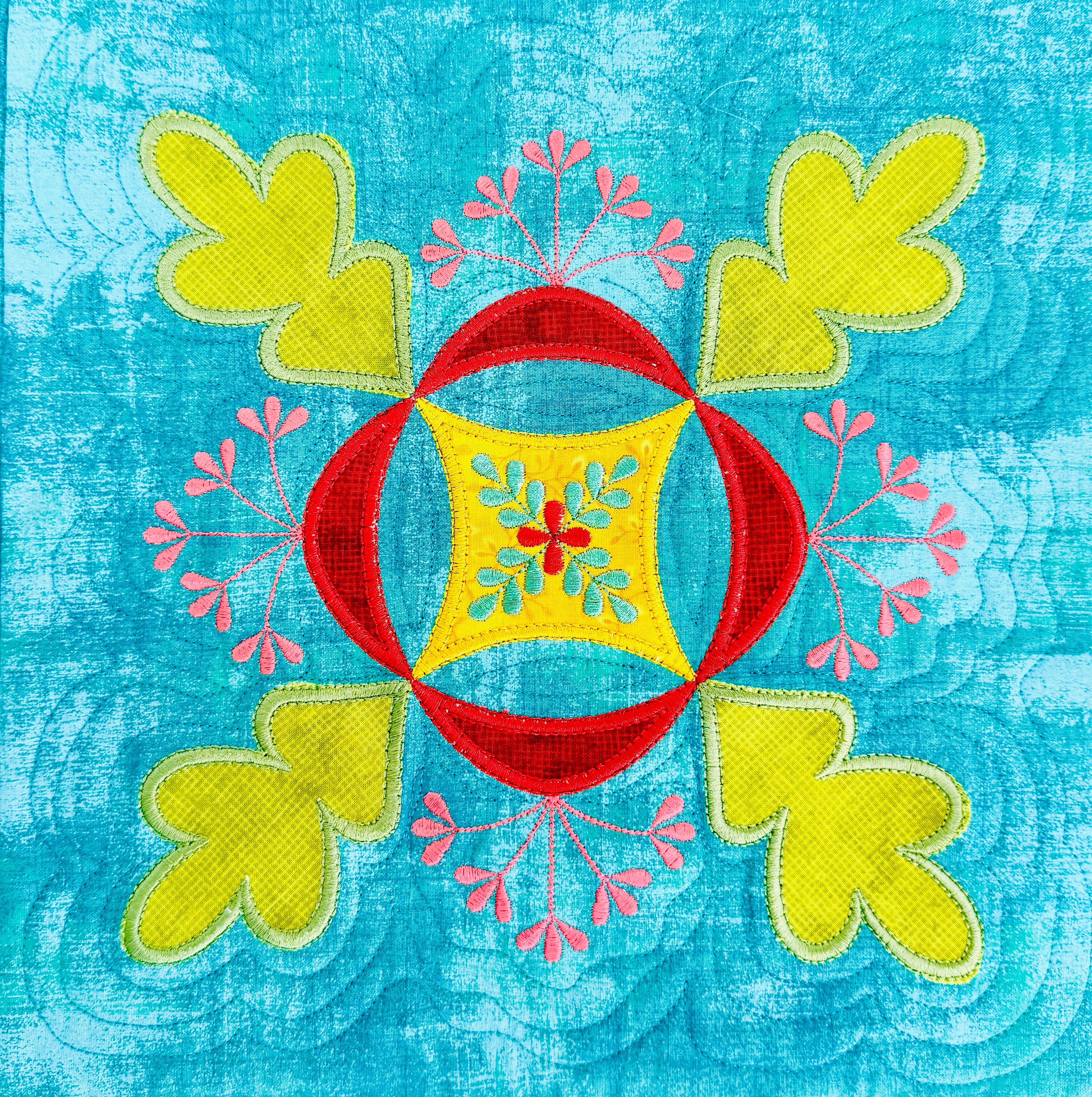 Colorful embroidered design on a textured blue background