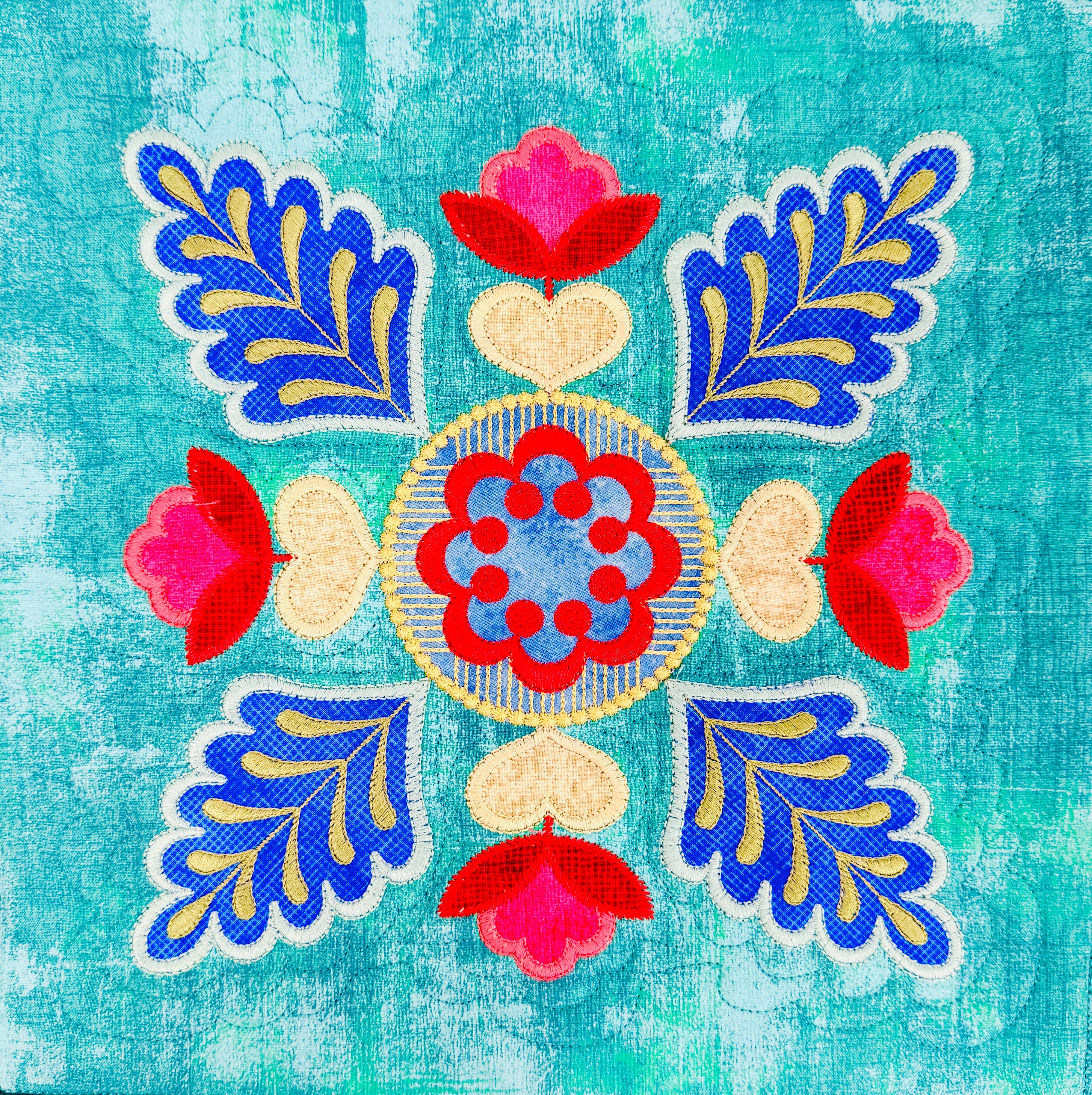 Colorful floral and leaf pattern on a textured blue background