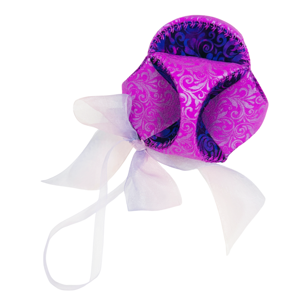A purple and blue patterned fabric pouch with a white sheer ribbon bow, isolated on a white background.