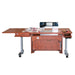A white, height adjustable sewing table with an electric lift and a filler panel, equipped with wheels for mobility.
