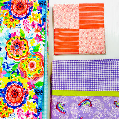 Colorful fabric swatches including floral, checkered, and patterned designs.
