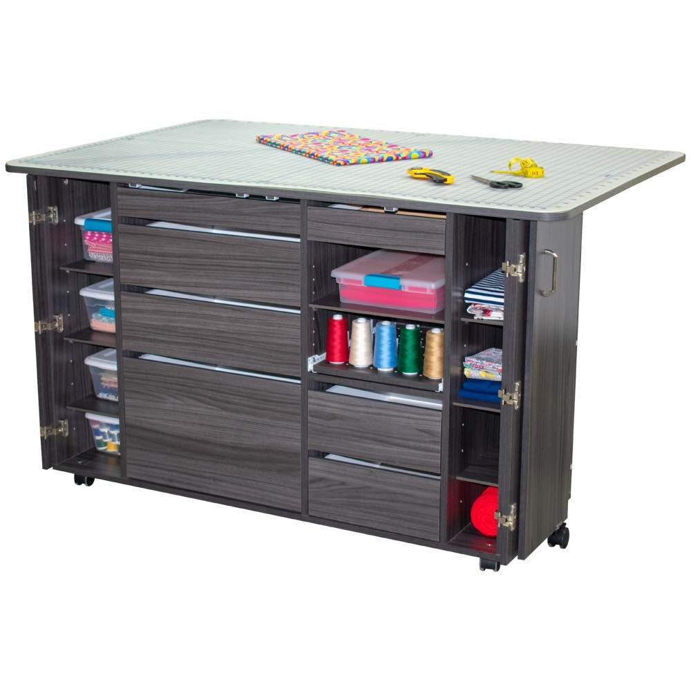 Gray craft table with multiple drawers and shelves on a white background
