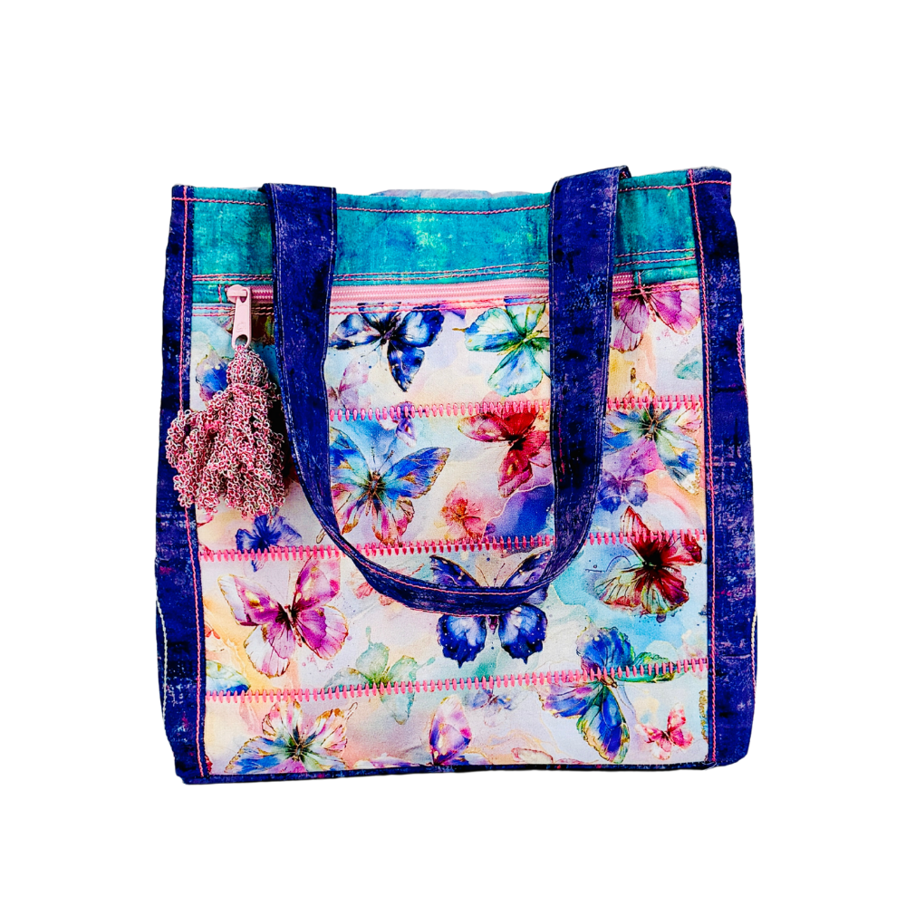Colorful floral-patterned tote bag with blue accents on a white background
