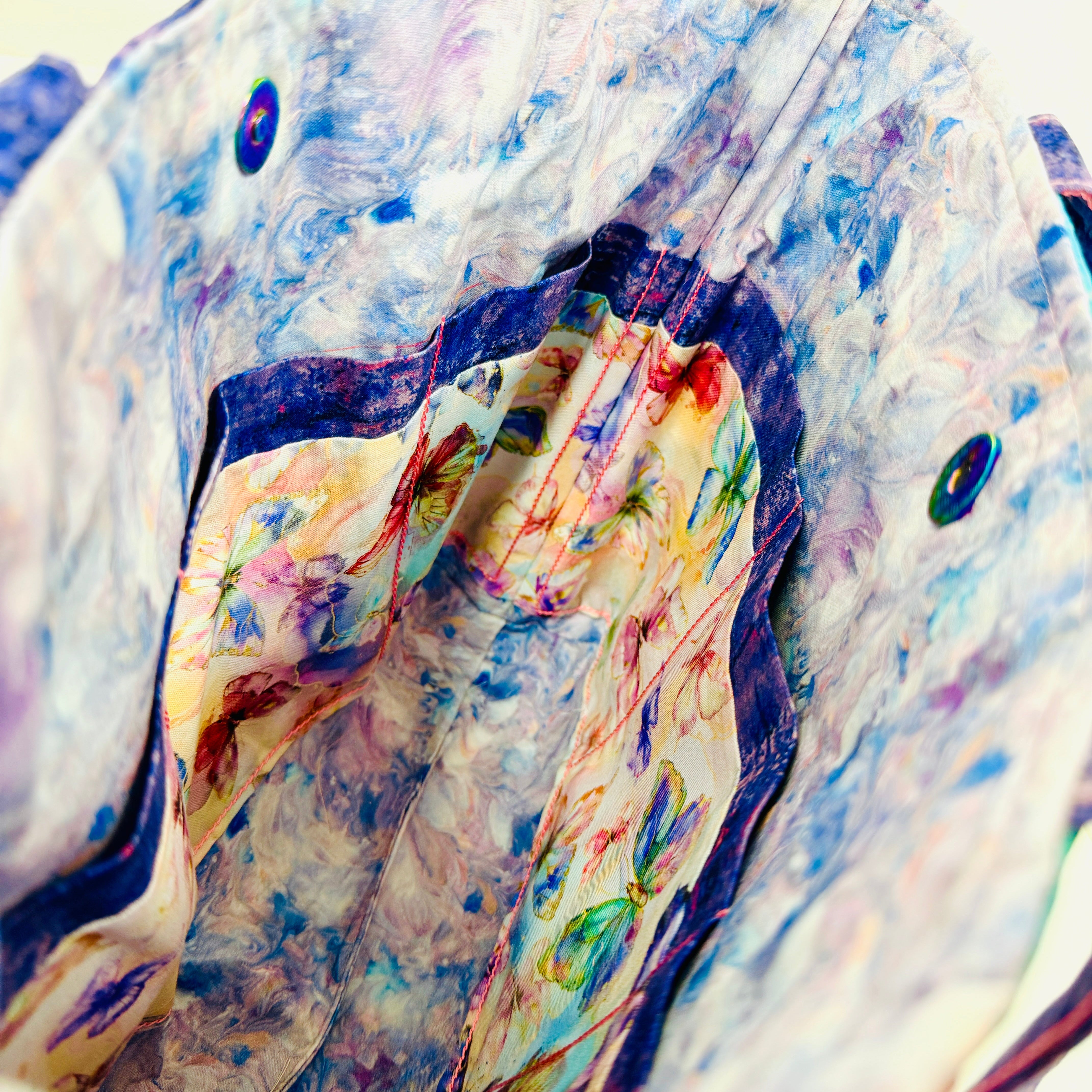 Close-up of inside of serger bag with colorful print fabric