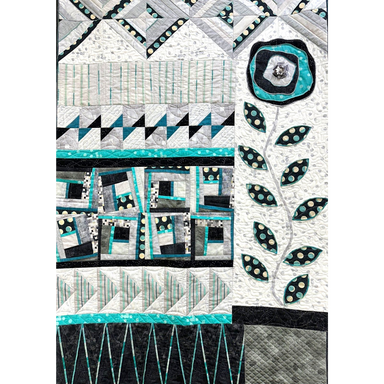 Bloom & Grow Serger Quilt with geometric patterns and a central floral design on a white background