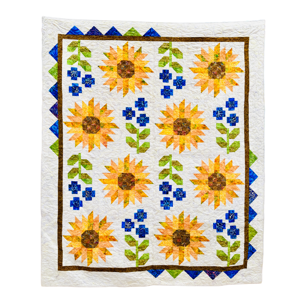Quilt with sunflower pattern on a white background