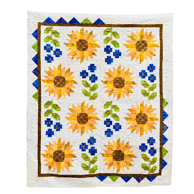Quilt with sunflower pattern on a white background