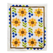 Quilt with sunflower pattern on a white background