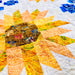 Quilt with sunflower pattern on a white background