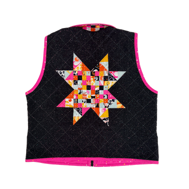 Black quilted vest with a colorful star pattern on a white background