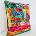 Colorful patchwork pillow on a white background