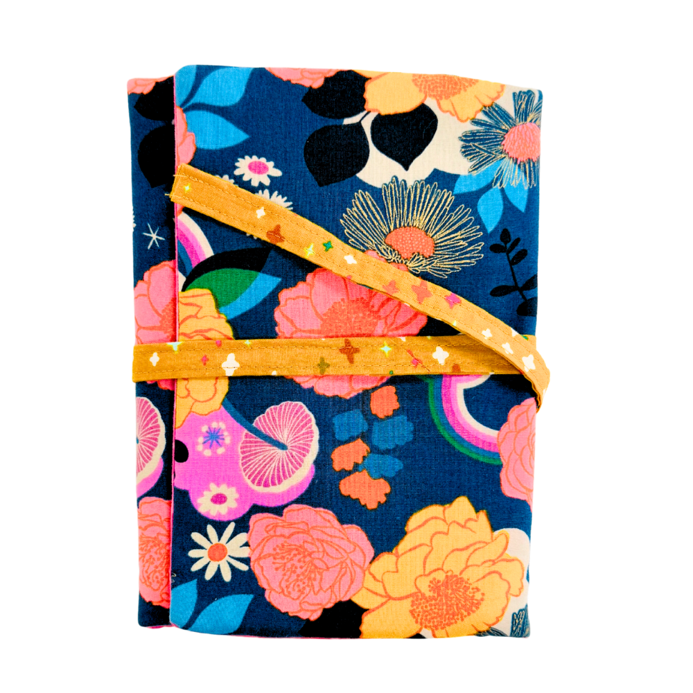 Floral-patterned fabric with a yellow ribbon on a white background
