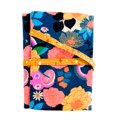 Floral-patterned fabric with a yellow ribbon on a white background