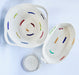 Two rope bowls with multicolored accents on a white background, along with a smaller circular piece of rope craft.