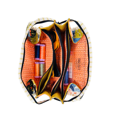 Colorful drawstring bag with fabric contents on a white background