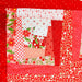 Patchwork quilt with red and floral patterns